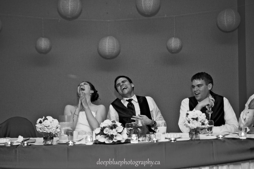 Natalie and Chris laughing at the reception