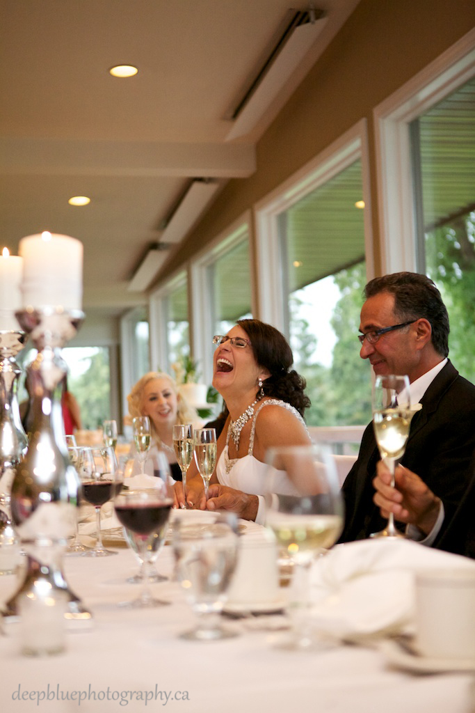 Picture Of Bride Laughing At Speeches At An Edmonton Golf And Country Club Wedding