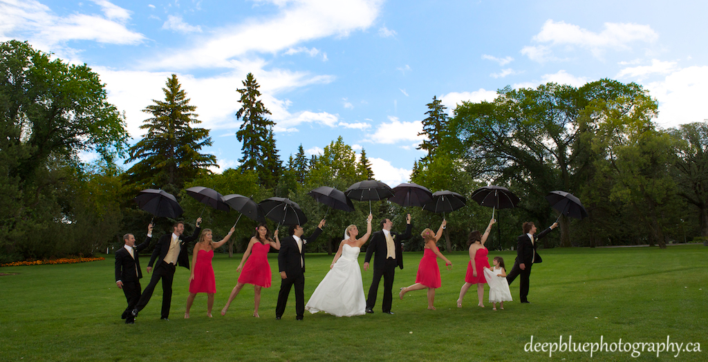 Kate and Ed with Wedding Party and Umbrellas