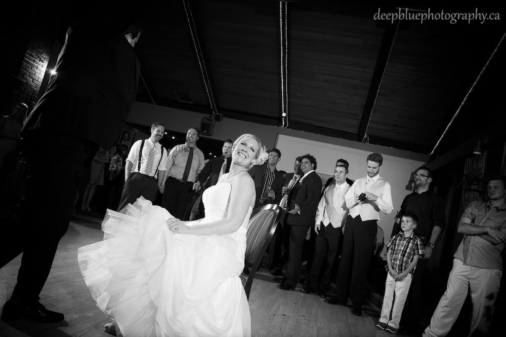 Photo of the Bride During the Garter Toss At Faculty Club Wedding