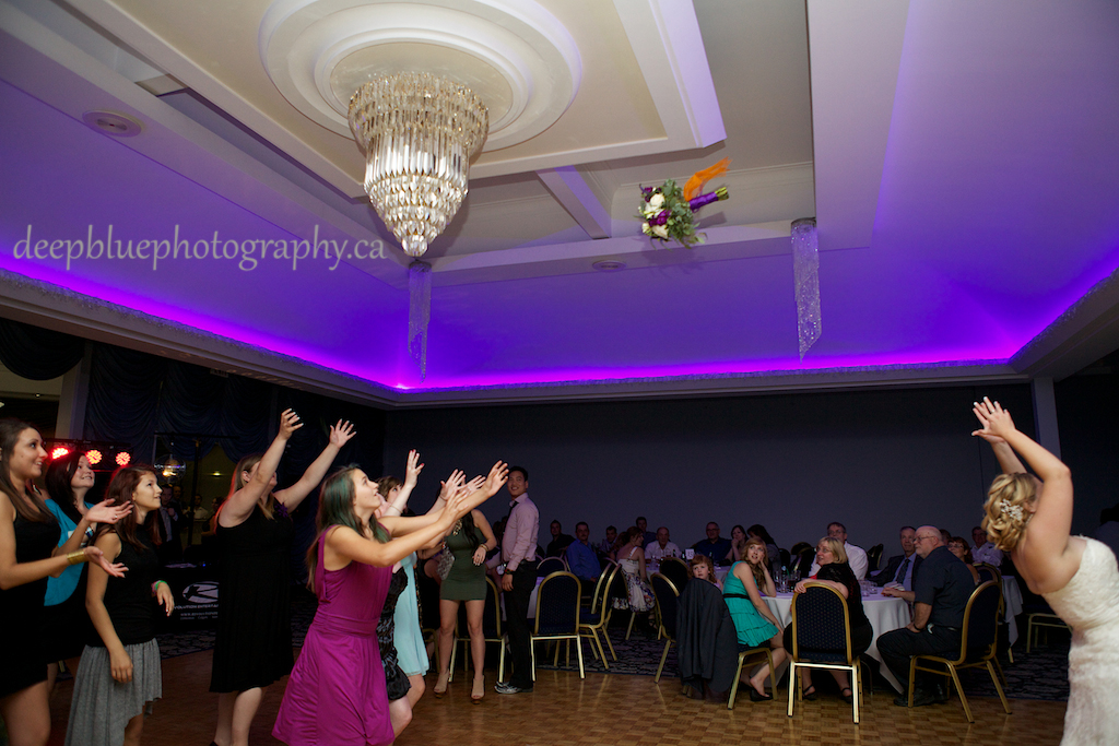 Bride Bouquet Toss at Chateau Louis Hotel Wedding Reception