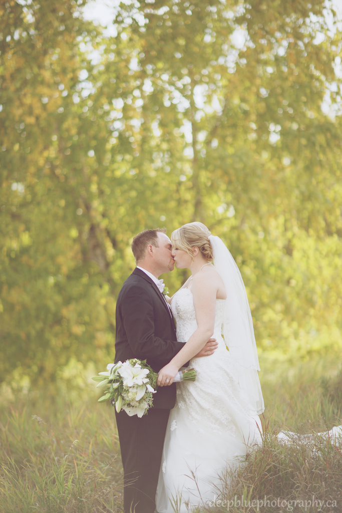 Photo of Bride and Groom Kissing