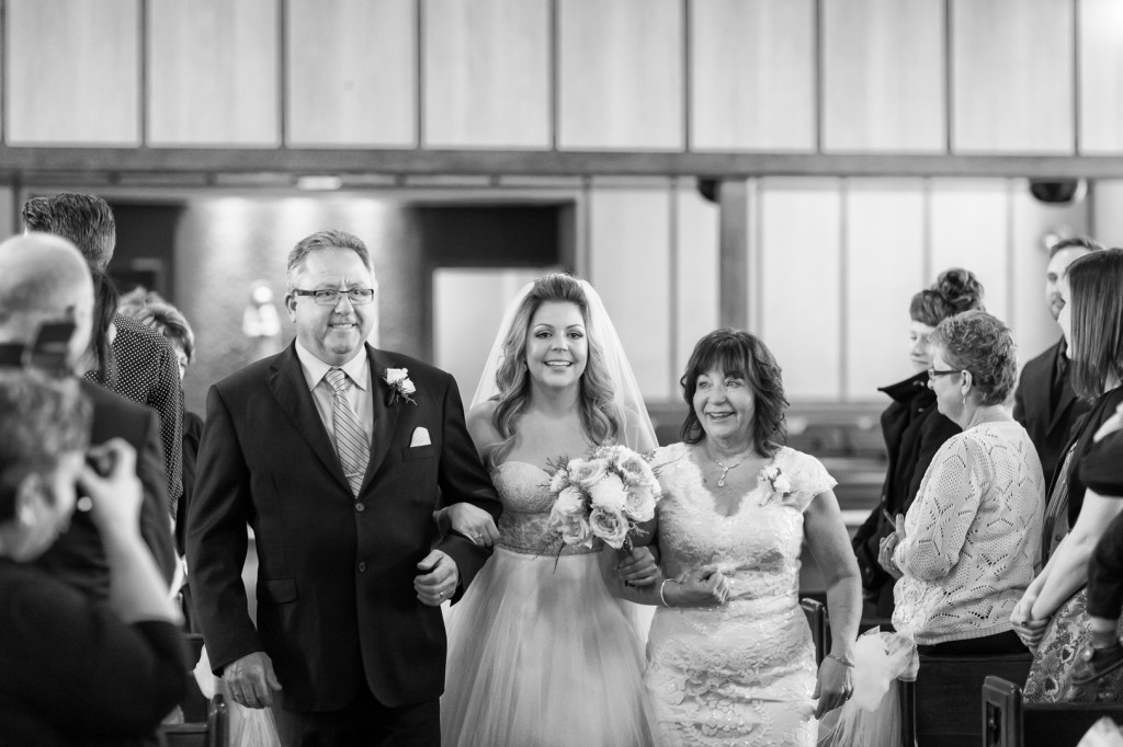 Photo of Bride Walking with Parents