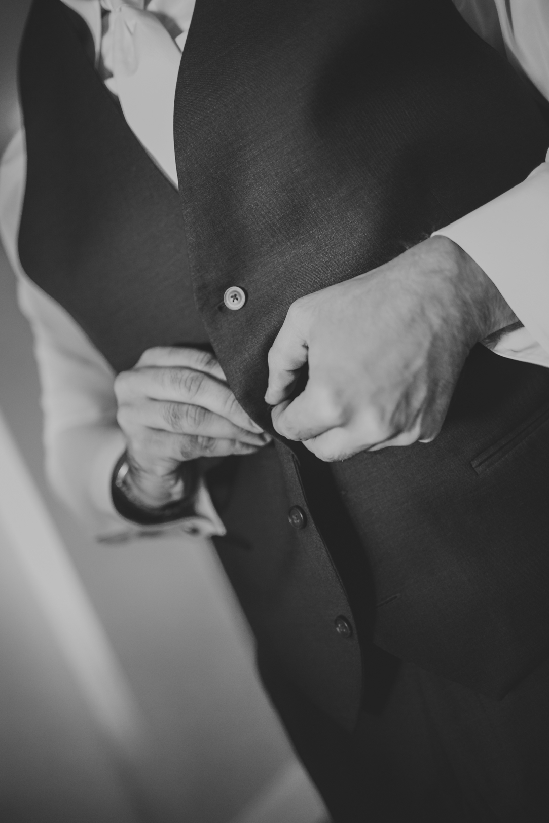 Groom Putting on Suit