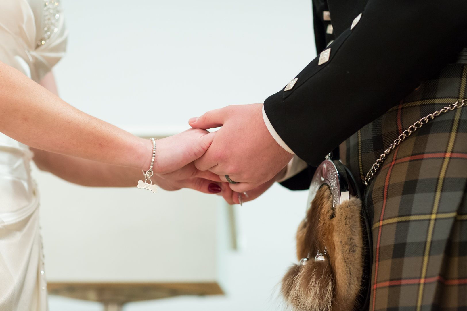 bride and groom holding hands