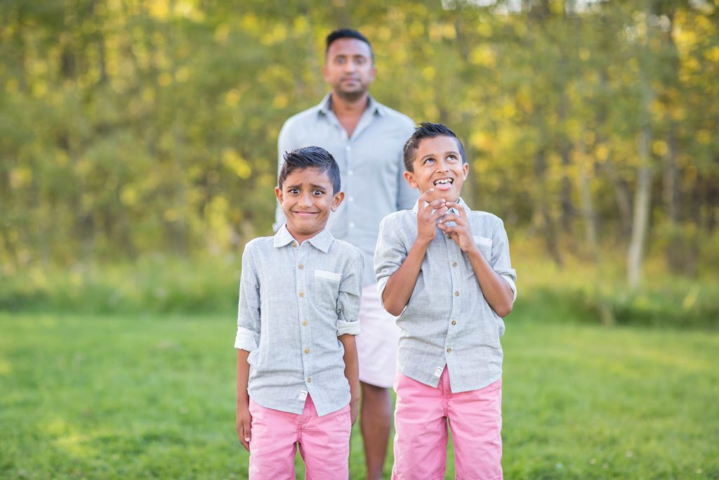 A picture of boys making faces during family photos