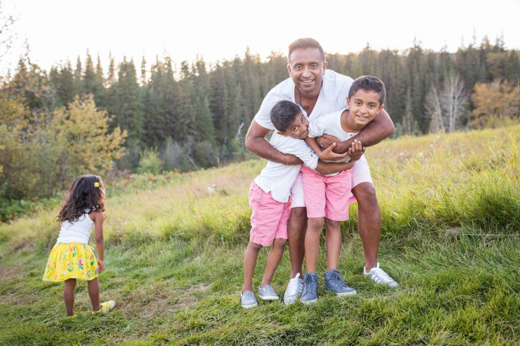 A picture of Dad playing with the kids during their photo session - Edmonton Family Photography