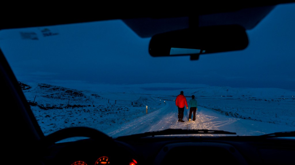 picture of couple at night while winter driving in iceland
