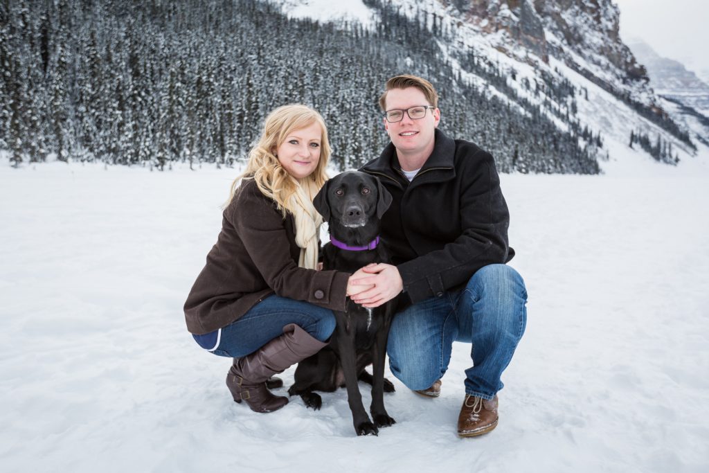 couple with their dog during mountain engagement session