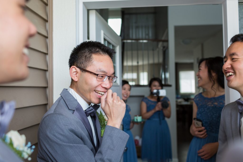 Groom playing games during traditional Chinese wedding