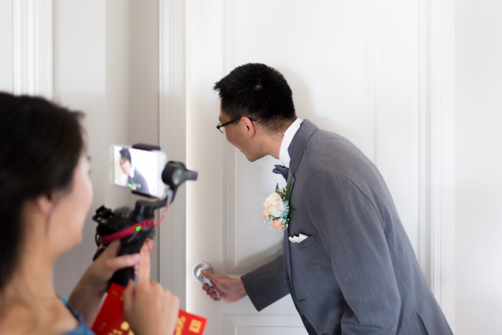 Groom seeing his bride for the first time during Chinese wedding