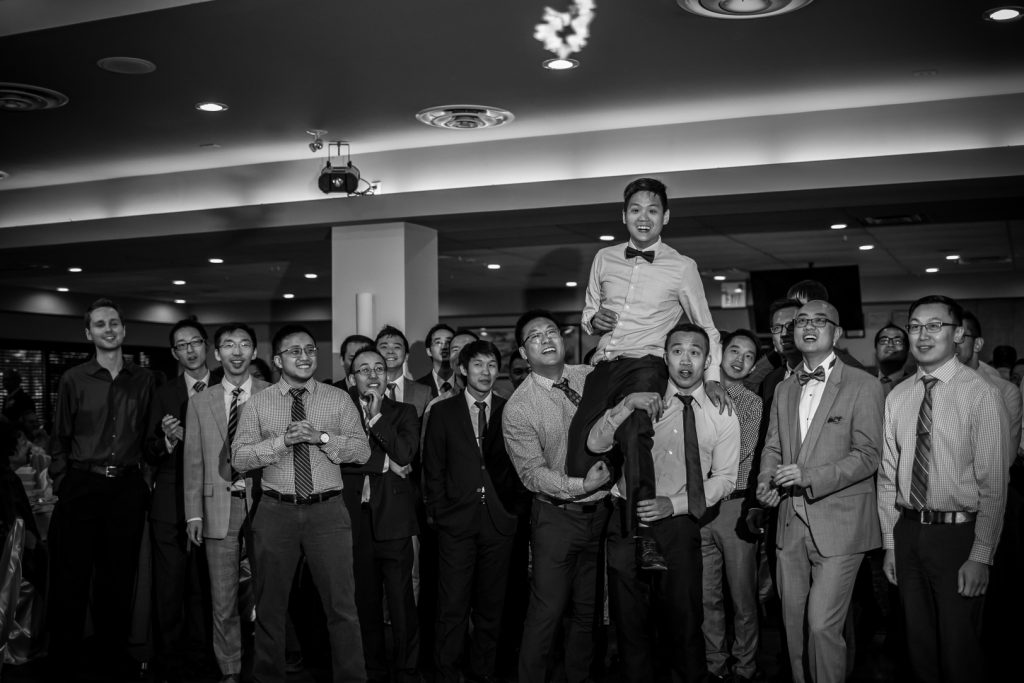 Garter toss photo during wedding reception at Cha for Tea