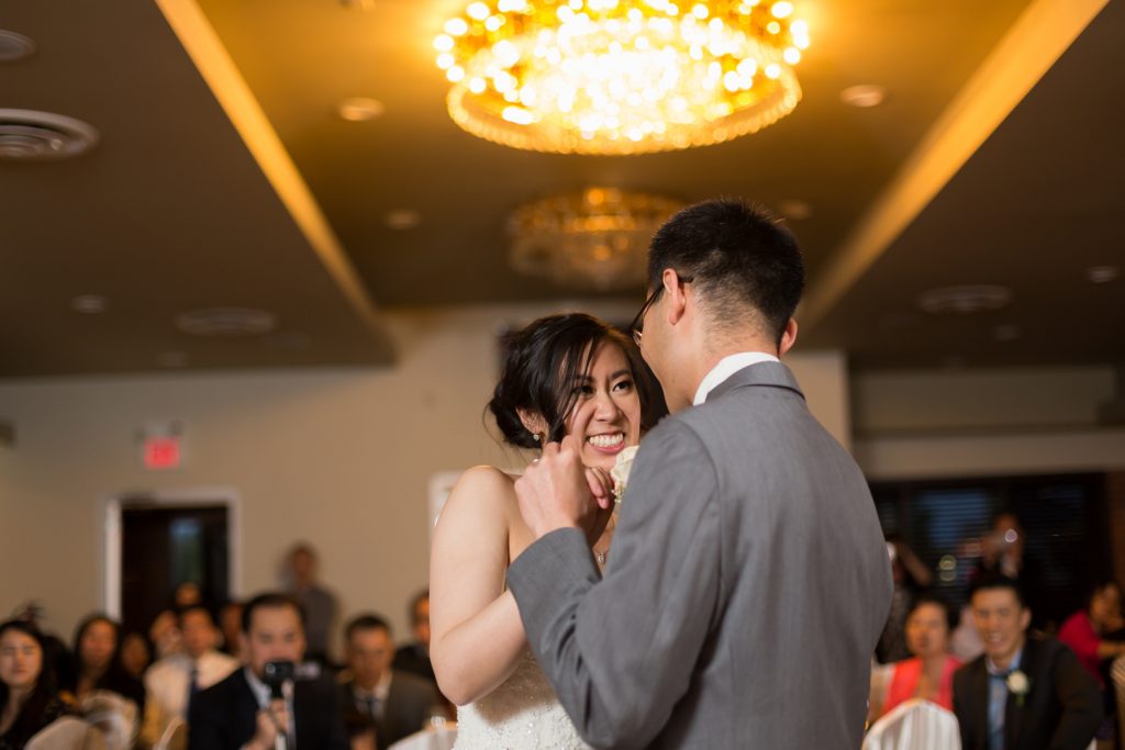 Chinese wedding reception, bride and groom share their first dance