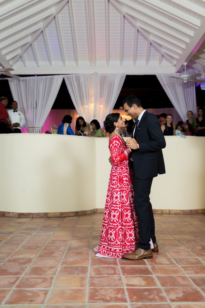 Bride and groom share their first dance in Antigua during their destination wedding reception