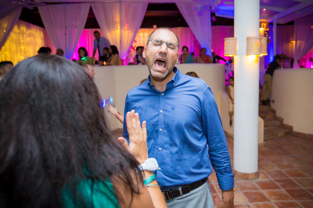 Guests dancing and singing during Antigua destination wedding