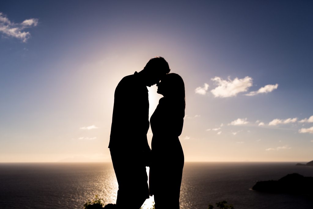 Sunset silhouette portrait of the bride and groom from the top of Antigua's Shirley Heights