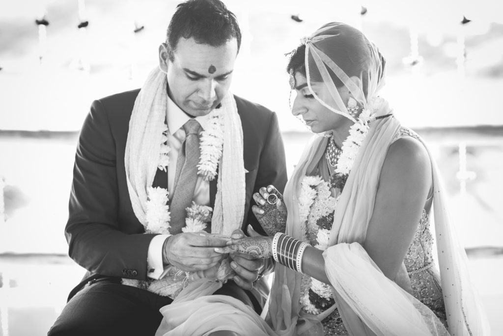 Indian couple keeps the tradition of exchanging rings at the end of their wedding ceremony