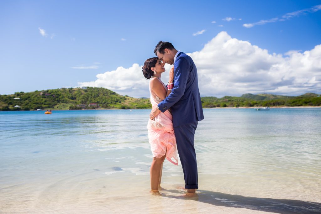 Bride and groom enjoy the warm waters of Antigua on their wedding day