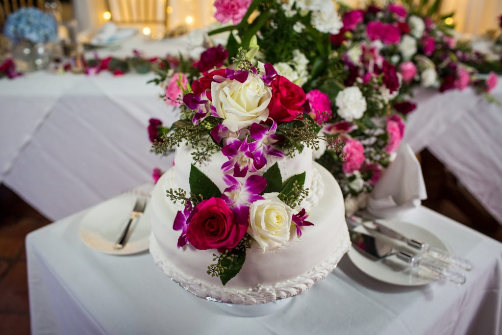 Flower covered wedding cake for Antigua destination wedding