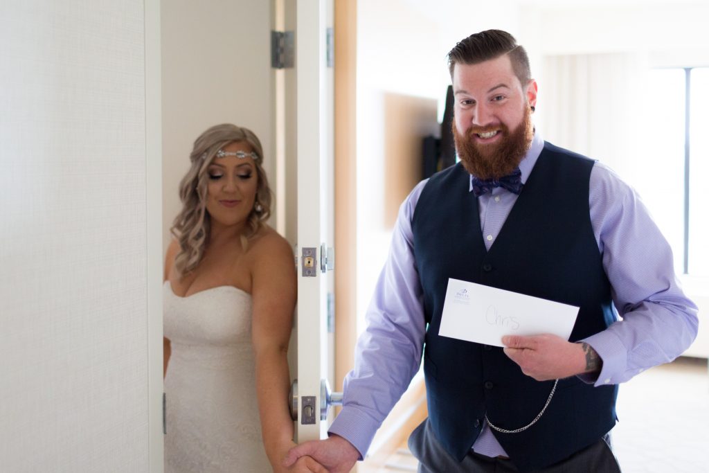 Bride and groom exchange love letters before their summer wedding ceremony at Snow Vally 