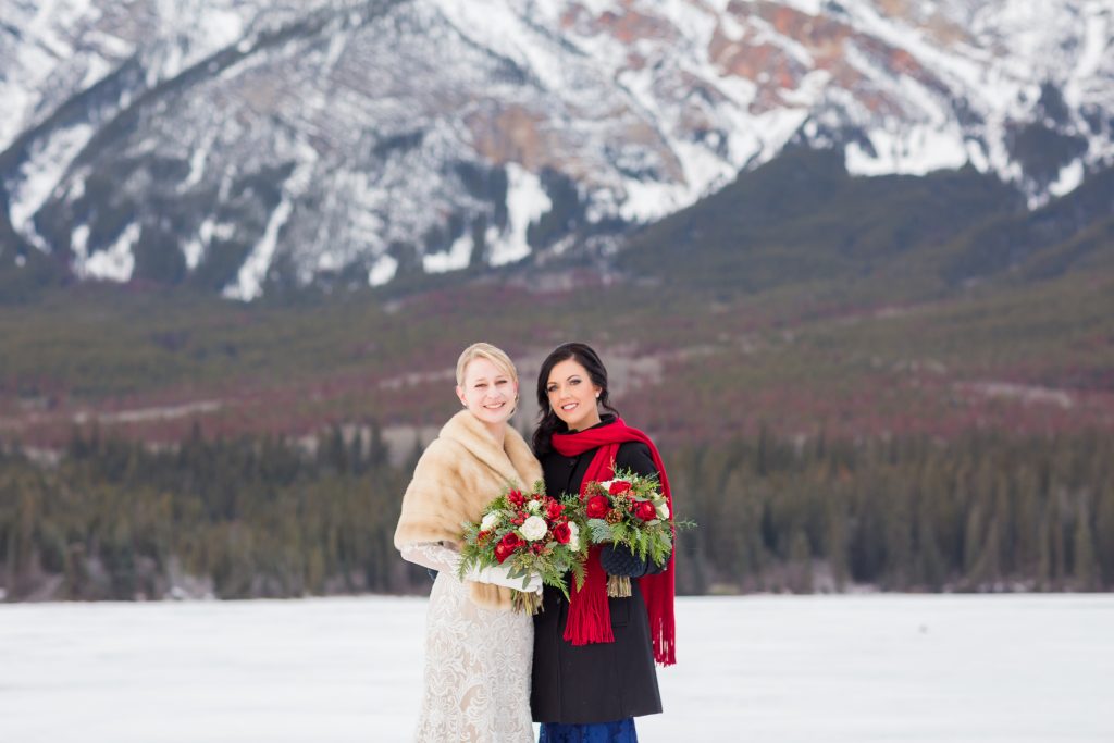 Bride and maid of honour portraits taken in front of the mountains at Pyramid Lake
