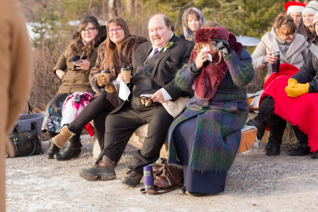 Candid emotional wedding photos of the family watching wedding ceremony at Pyramid Lake