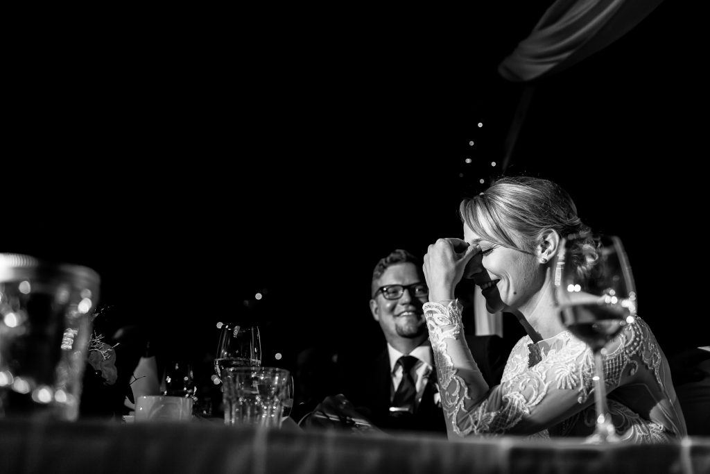 Bride laughing during speeches at Pyramid Lake wedding reception