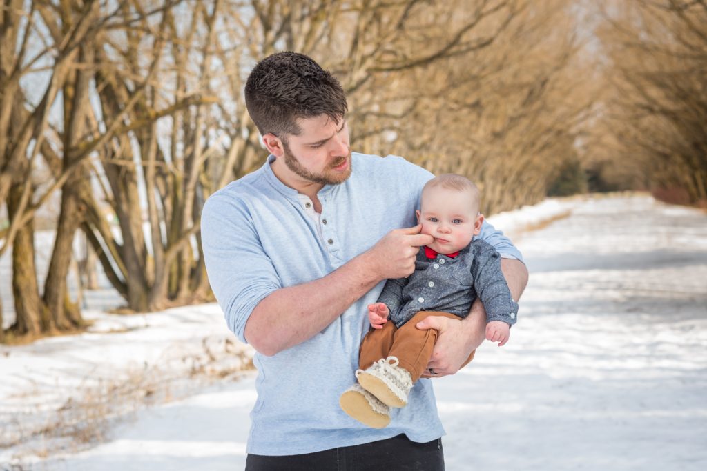 father and son during outdoor winter family photos