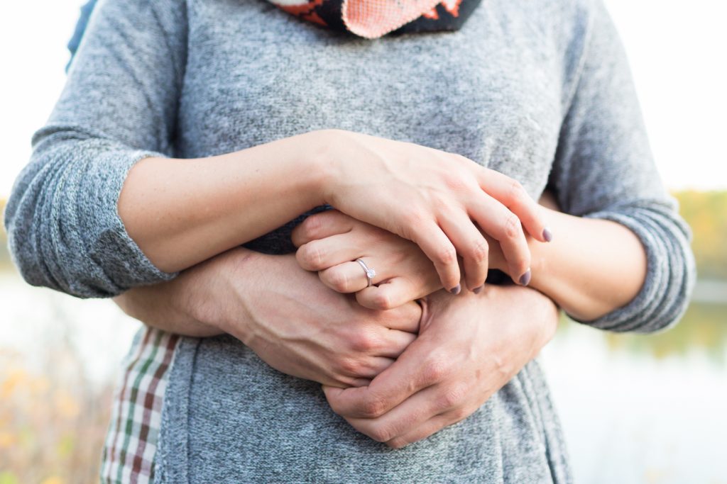 Detail photo of couple holding hands during their engagement session