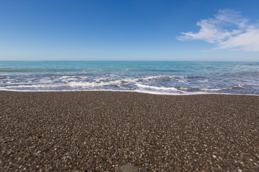 New zealand black sand beach picture