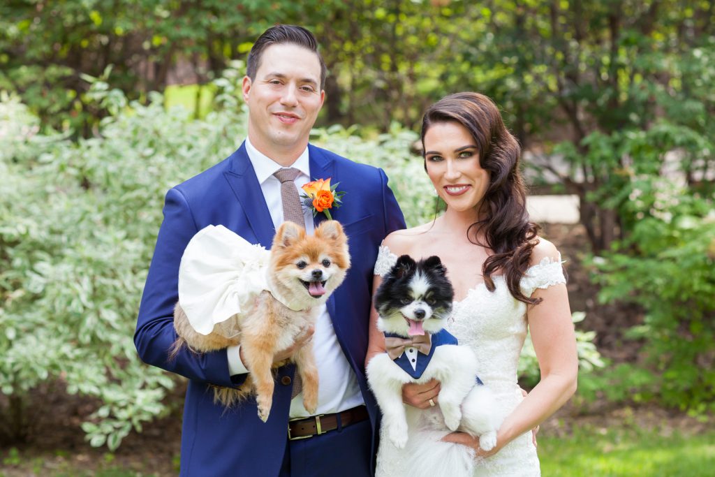 Bride and groom with their dogs