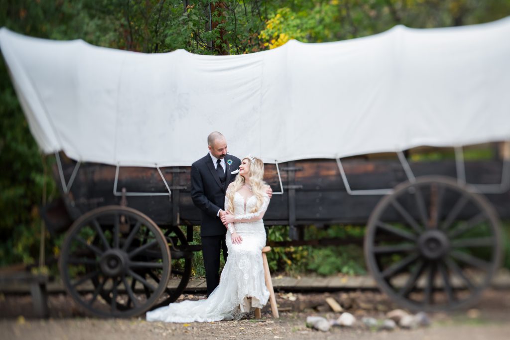 wedding portrait with covered wagon