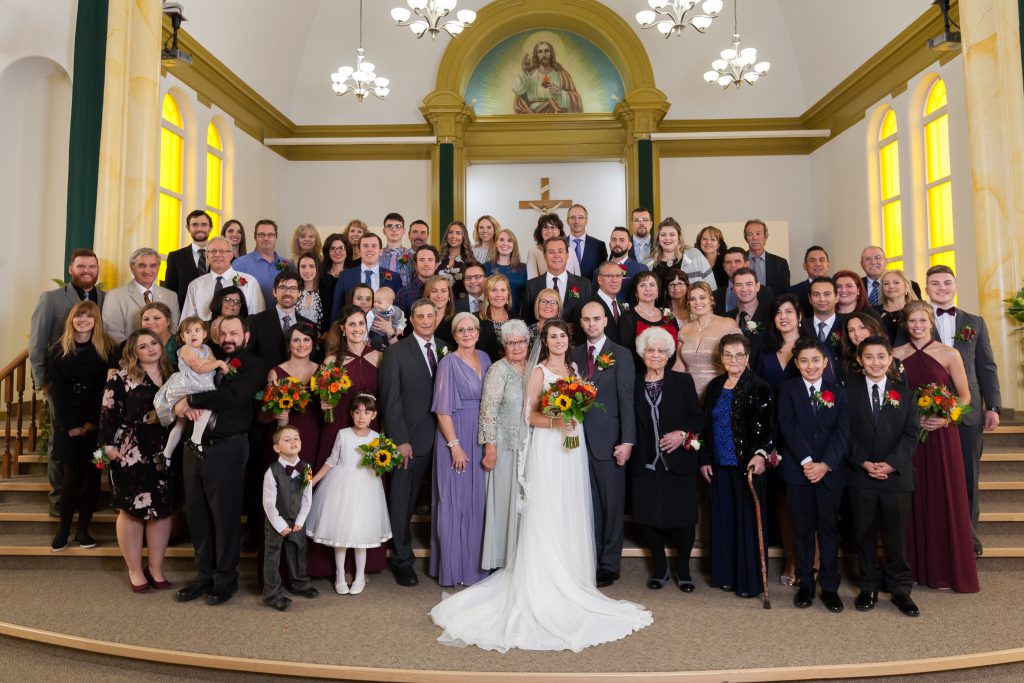 large family portrait at wedding