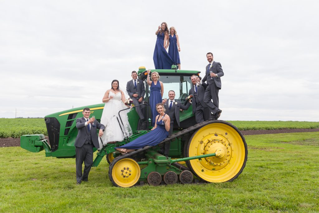 wedding party photo with tractor